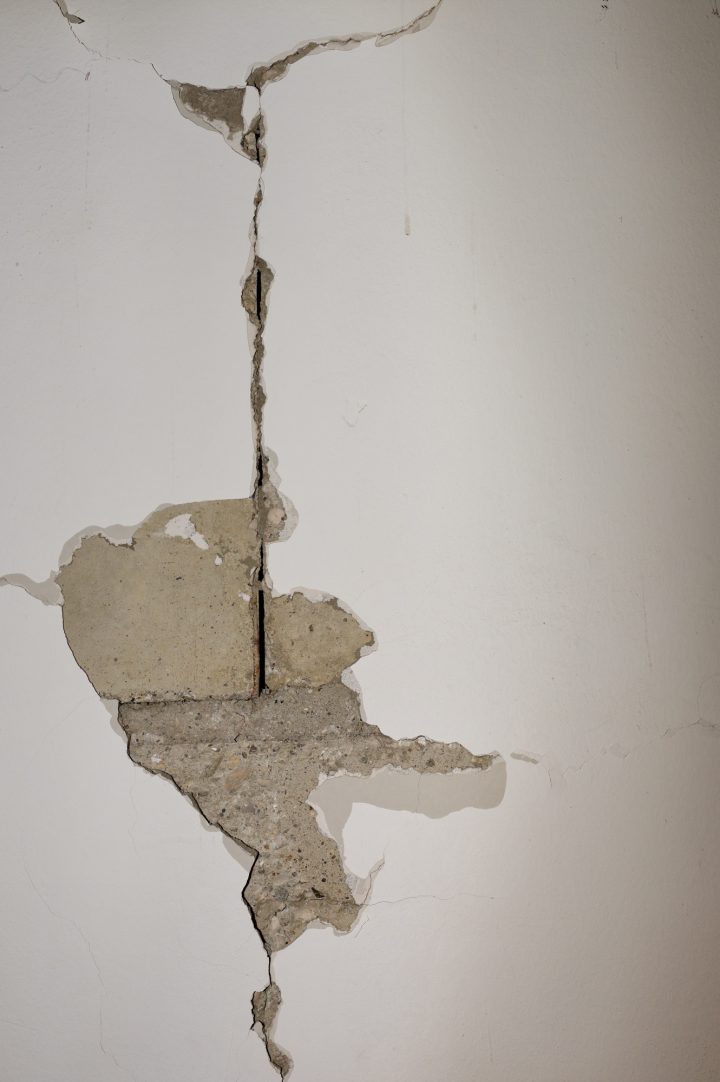 White wall of the house with a huge crack after earthquake
